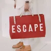 Instagramのメンズハンドバッグ、牛革ピンクの旅行バッグ、文字キャンバスバッグ