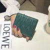 Portefeuille le mieux vendu neuf 85% de promotion d'usine portefeuille féminine de style nouveau petit et ultra mince clip cuir polyvalent sac de carte pliant grande capacité sac simple
