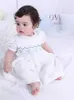 Robes de baptême bébé fille blanche à la main