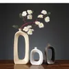 Vases Home Oval Hollow Out Handicraft Accessoires de fleurs modernes Arrangement de décoration Vase Vase Céramique Abstraction