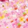 En gros de 100pcs pour enfants dessin animé bonbons fleuris d'animal forme de noix de nœud mix mix joail de bijoux anneaux