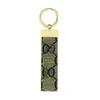 Designer Keychain Torchia di lusso multicolore Donne uomini uomini marrone borsetta in pelle grigliere oro accessori placcati portachiavi con lettere top54