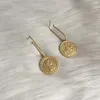 Boucles d'oreilles en pente à la mode de couleur ordage de couleur de monnaie