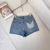 Marque de créateurs de shorts pour femmes printemps et été nouveau PRA style littéraire micro-élastique coton pure fashion petite foule haute taille denim 11sv