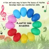 Instruments 12pcs Oeuf Shakers Instruments de musique Percussion Oeuf pour enfants Toys Plastique Pâques Shaker pour l'éducation Apprentissage musical