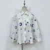 Designer's two-piece linen material lapel long sleeved set with starry moon embroidery casual set, shirt and widened leg shorts set