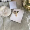 Merkontwerper Nieuwe kokosboomvormige broche luxueuze 18K vergulde modieuze veelzijdige veelzijdige broche hoogwaardige sieraden charmante vrouwen hoogwaardige broche box