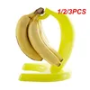 Kök förvaring 1/2/3st Fruit Fresh Keeping Hook Holder Decoration Yellow Banana Shape Fruits Display Stand Desktop Gruva