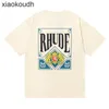 Rhude High End Designer Roupos para manga curta High Street Fashion Summer Men and Women Gênero Cartões grátis Impresso Caminhadas de algodão solto Moda com 1: 1 Rótulo original