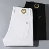 Designer di jeans maschile europeo nuovo primavera/estate jeans puro in bianco e nero in bianco e nero elastico alto elastico Slimt fit coreano semplice pantaloni maschi xooy xooy