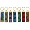 Designer Keychain Torchia di lusso multicolore Donne uomini uomini marrone borsetta in pelle grigliere oro accessori placcati portachiavi con lettere top54