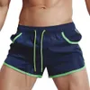 Mäns shorts Mens Sports Beach Shorts Swimming Pants Running Sports With Pockets Color Matching SPD Dry Gym Shorts Summer Swime H240508