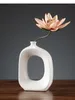 Vases Home Oval Hollow Out Handicraft Accessoires de fleurs modernes Arrangement de décoration Vase Vase Céramique Abstraction