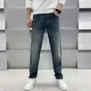 Designer de jeans masculin automne / jean d'hiver avec de petits pieds droits slim fit élastique lavage haut de gamme luxe de luxe épaississant 5wty