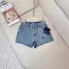 Marque de créateurs de shorts pour femmes printemps et été nouveau PRA style littéraire micro-élastique coton pure fashion petite foule haute taille denim 11sv