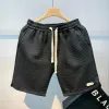 Shorts masculinos praia de verão solto de fitness seco de fitness, executando shorts de esportes de corrida casuais masculinos Padrão de onda de cor de amarração de cor sólida