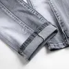 Jeans masculin New Spring Mens Ripped Hole Jeans décontracté slim fit gris jean pantalon masculin Hip Hop Denim Pantalon Straight Pantnes Hombre T240507