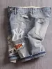 Shorts en denim pour hommes avec trous lavés de style coréen de style coréen de style droit de route jeans 240507