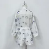 Designer's two-piece linen material lapel long sleeved set with starry moon embroidery casual set, shirt and widened leg shorts set