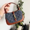 2024 Summer New Same Style Saddle Full Leather Denim Print One Shoulder Underarm Handbag Crossbody Bag 80% factory wholesale