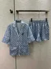 Kvinnors tvådelade byxor Designer Designer Brand Pyjamas stil kostym tryckt kort ärmskjorta med elastiska band shorts tillbaka blommig utsmyckande underdrift tk5q 4yos
