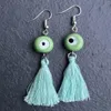 Boucles d'oreilles en peluche de mode de commerce extérieur fournit des caractéristiques nationales simples yeux bleus perles acryliques Tassel Outlet d'usine