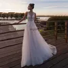 Princesse rose clair plage une robe de mariée en ligne Sous-couches en V Robe de mariée appliquée