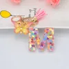 Keychains Lonyards Nouveaux exquis résine de 26 lettres porte-clés avec psychotel gradient papillon pendent clé anneau féminin de sac d'ornement accessoires cadeau j240509