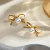 Boucles d'oreilles étalon 18k plaqués en acier inoxydable bowknot suspendu blanc étanché