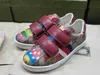 Nya baby sneakers tecknad mönster trycker barnskor storlek 26-35 Högkvalitativ varumärke förpackning spänne band flickor skor designer pojkar skor 24 maj