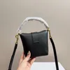 Bolsas de cuerpo cruzado bolso de cubo bolso para mujeres hombro hombro de cuero real diseñador de marca de cuero carro de caramelo femenino 230704