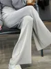 Женские брюки Capris Лето новая изогнутая изогнутая бусина шелковая шелковая ткань с высокой эластичной полосой с высокой талией широкие ноги простые и модные женские брюки Q240508