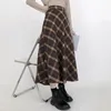 Werkjurken vrouwen sierlijke pure kleur trui geruite rokken 1 of 2 -delige set 2024 Koreaanse dame gebreide pullover midi rok pakken breierkleding