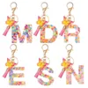 Keychains Lonyards Nouveaux exquis résine de 26 lettres porte-clés avec psychotel gradient papillon pendent clé anneau féminin de sac d'ornement accessoires cadeau j240509