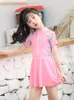 Kvinnors badkläder solid färg kjol stil barn baddräkt för flickor 5-16 år gammal koreansk version två bit simning vid havet