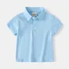 T-shirts Summer Boys Polo T-shirt Coton Polo Collier préscolaire bébé T-shirt Childrens T-shirtl240509