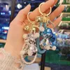 Keychains Lonyards Chain de clé ours électroplate avec une corde en cuir tissé Pendante Animal Keychain Fashion Doll Sac Auto Key pour filles Cadeau J240509