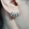 Boucles d'oreilles Stud Huitan Design à la mode Piercing pour les femmes avec des bijoux polyvalents pour filles modernes de pierre cz éblouissante