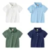 T-shirts Summer Boys Polo T-shirt Coton Polo Collier préscolaire bébé T-shirt Childrens T-shirtl240509
