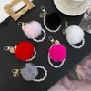 Keychains Lanyards Hot Selling Kaii Söt björn Keychain för kvinnor Gummy Bear Pom nyckelkedja Girly Wristlet Keychain Faux Pearl för ryggsäck J240509