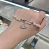 Charme Westwood Saturne Full Diamond Pin Pearl Bracelet Hollow High Version stéréoscopique