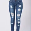 Kvinnors jeans 2024 design grossist damer sexig klocka botten staplade stretch mager plus size flare denim byxor rippade kvinnor