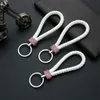 Keychains Lanyards 1pcs Corde à tricot en cuir Crystal clé de clés de luxe Metal Holder Hand Woven Couple Cadeau Femmes Fashion Course accessoires J240509