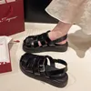 Chaussures décontractées baotou sandales féminines 2024 étudiant d'été tissage cage cochon cage plat fond rétro sable français femelle romaine