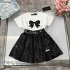 Nuove ragazze vestiti estivi per bambini tracce di sedui per bambini abiti da design dimensioni 90-150 cm t-shirt decorato e paillettes lucido gonna corta 24 maggio