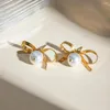 Boucles d'oreilles étalon 18k plaqués en acier inoxydable bowknot suspendu blanc étanché