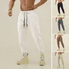 Pantalon masculin des hommes arborent un pantalon à bandes à la cheville à cordon de gym de taille élastique en train de jogging pantalon de survêtement