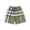 Mulher curta designer masculina shorts para homens preto e cinza xadrez reto e quente quente tronco de banho curta