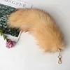 Keychains Lanyards 2024 New Fox Tail Keychain Wolf Tail Fur Tassel Bag Label Black and Brown Pom Charm Keychain Bracket Str Chain Gift J240509