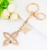 Crésivement Clover Keychain Gold Key Holder Metal Key Chain Fashion Course Courti Chaire de charme Auto Pendant Gift Whole G10193992121